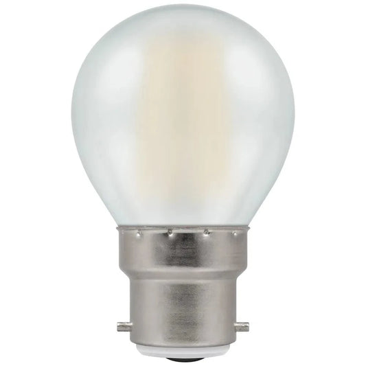Clear light bulb with metal base on a white background