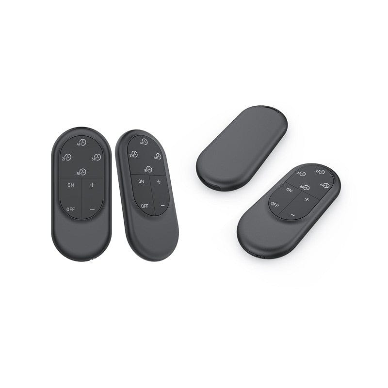 Two black remote controls designed for operating LED candles with timer functions.