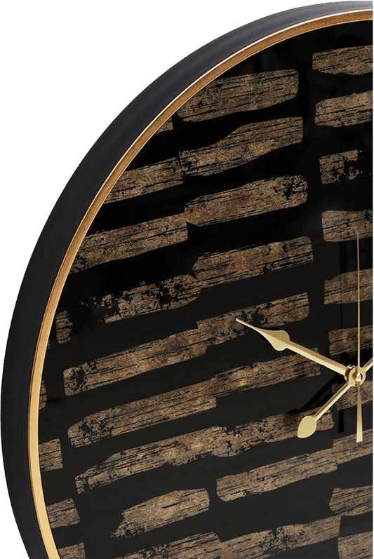 Wall clock with black and gold design on a white background