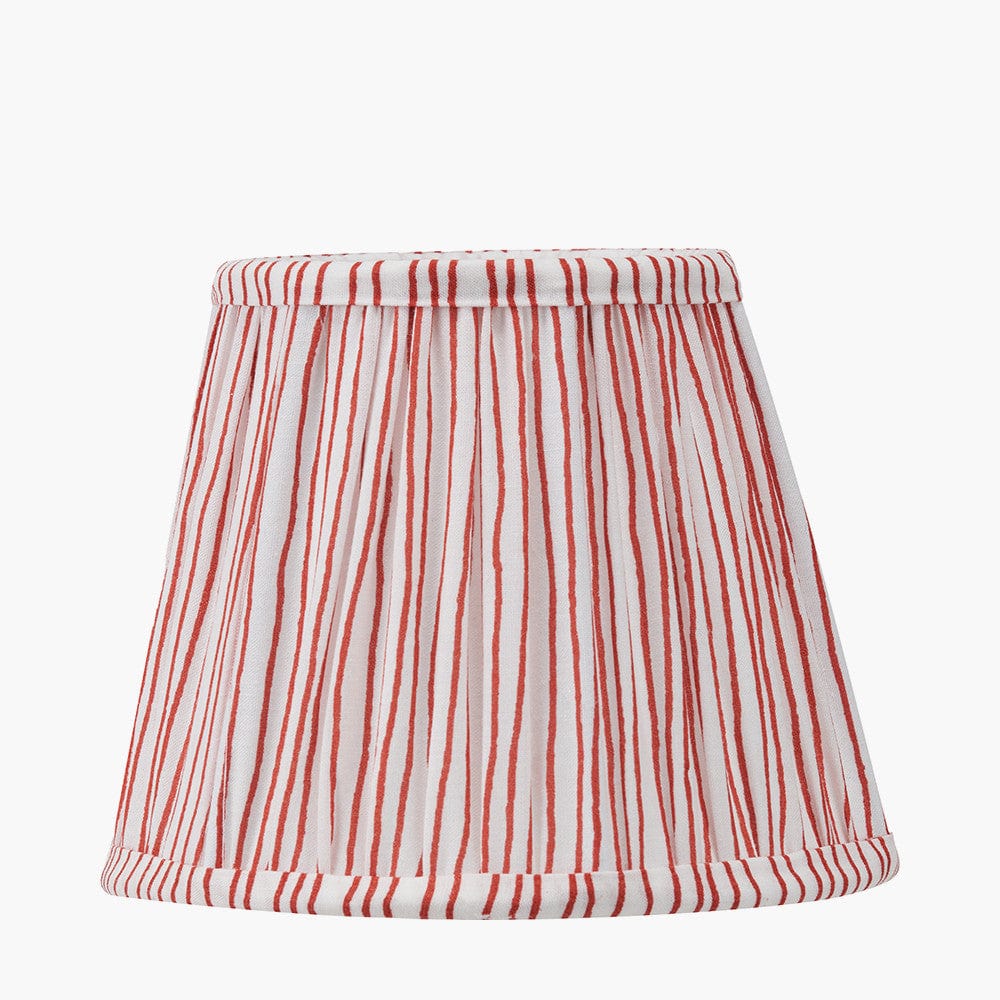 Striped lampshade with red and white pattern on a white background