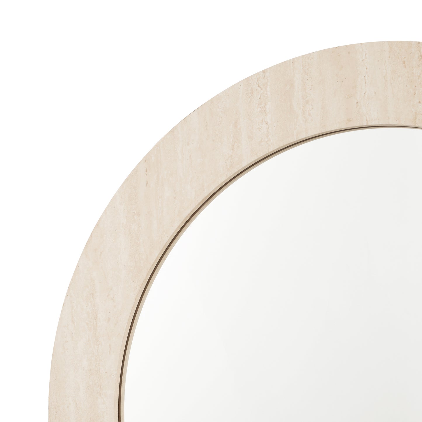 Close-up of a round mirror with a beige frame on a white background