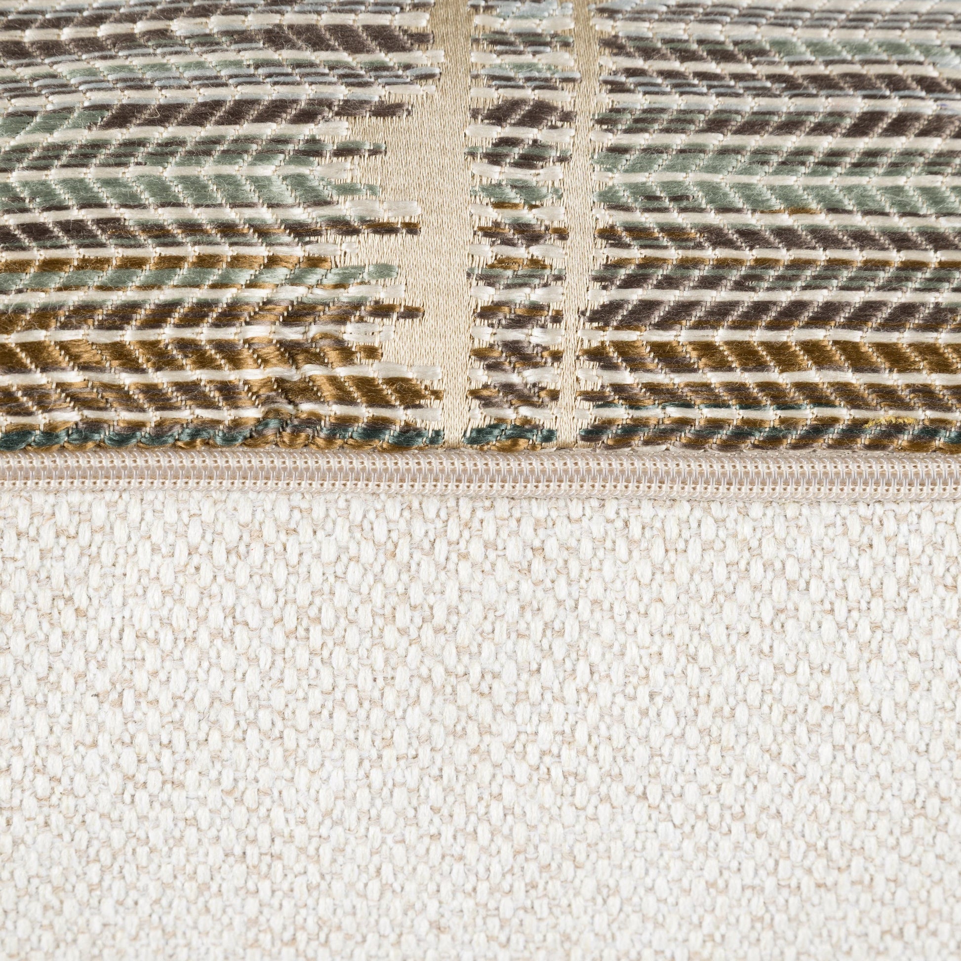 Close-up of a woven fabric with a striped pattern on a beige background