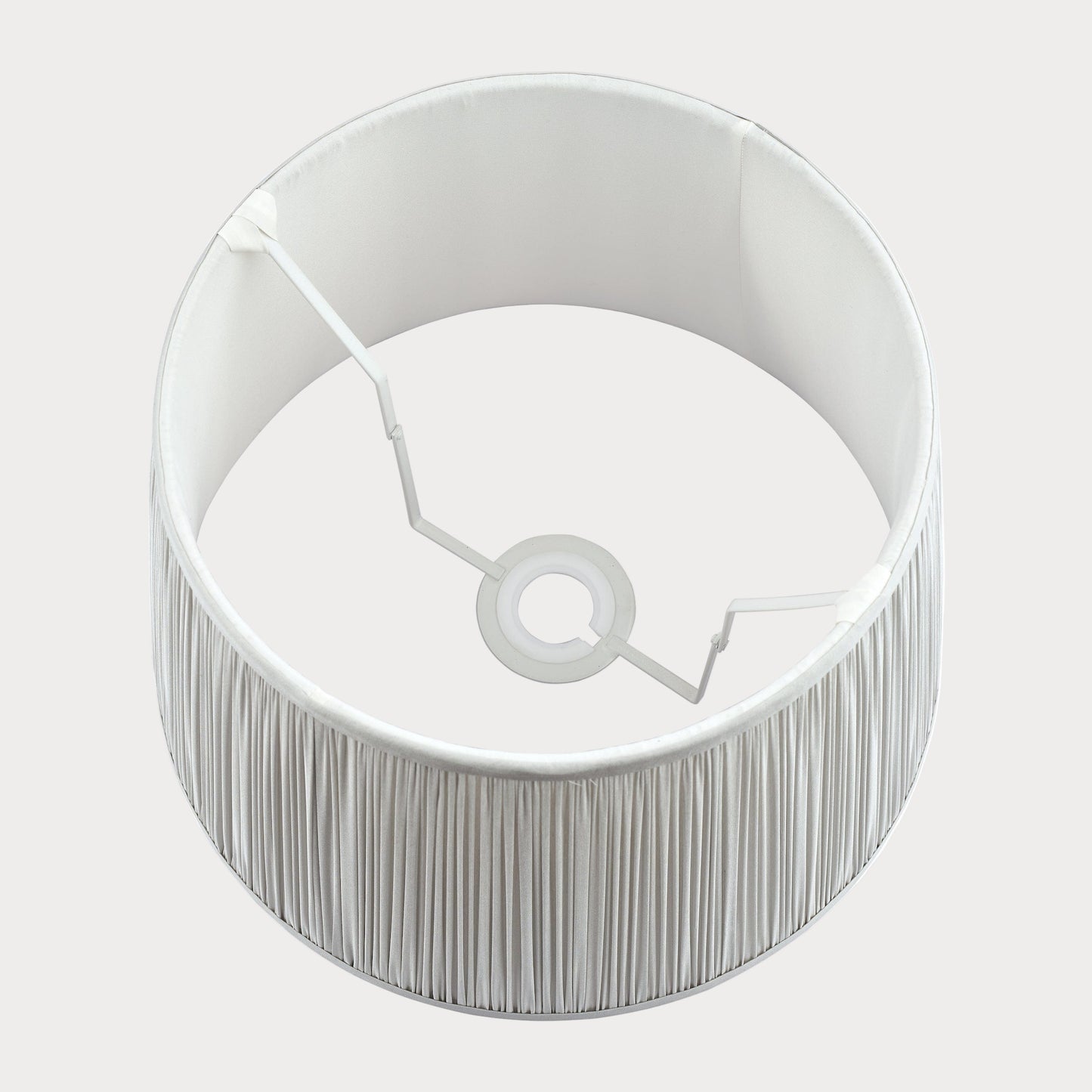 Silver lampshade with a textured base on a white background
