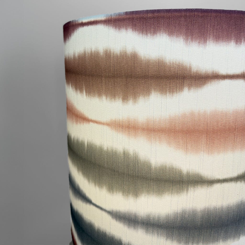 Close-up of fabric with multicolored pattern on a gray background