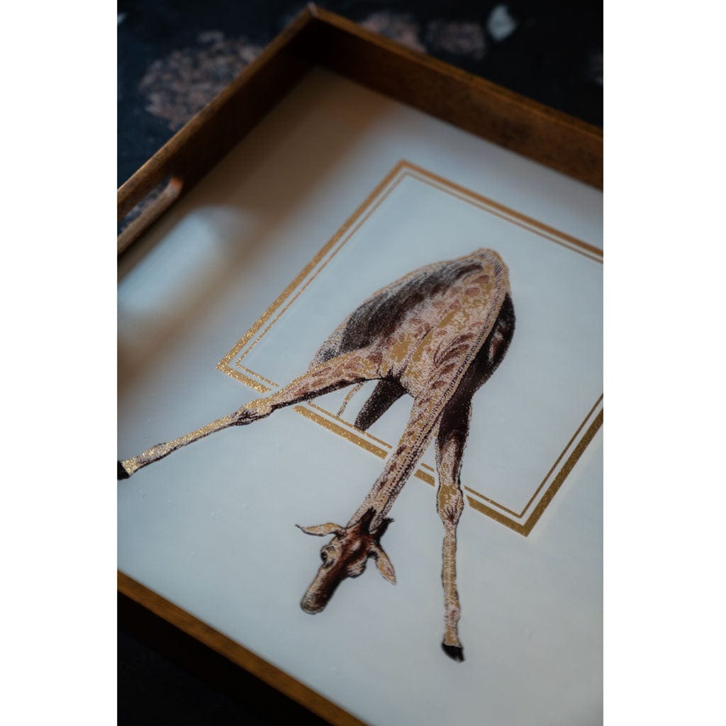 Decorative tray of a giraffe on a white background with a gold border.