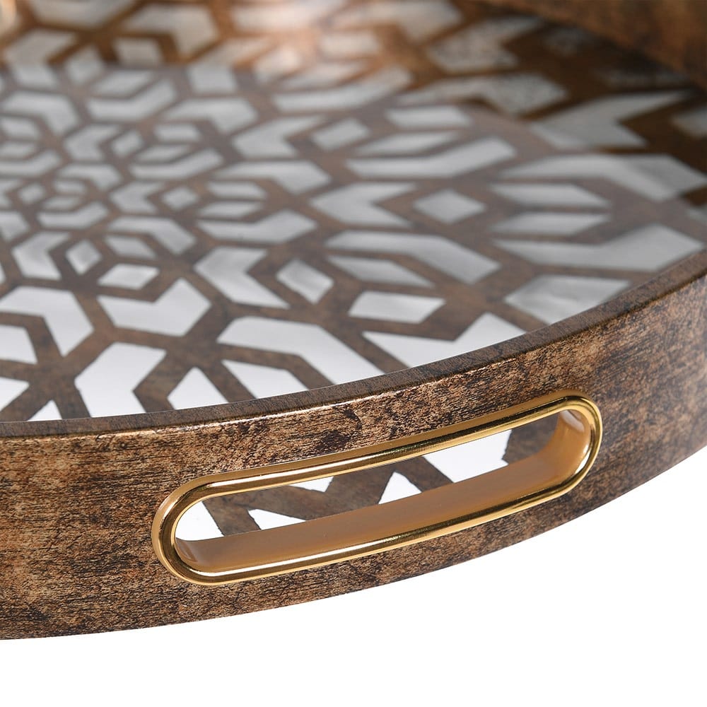 A round antique gold mosaic tray with intricate mosaic detailing on the surface.