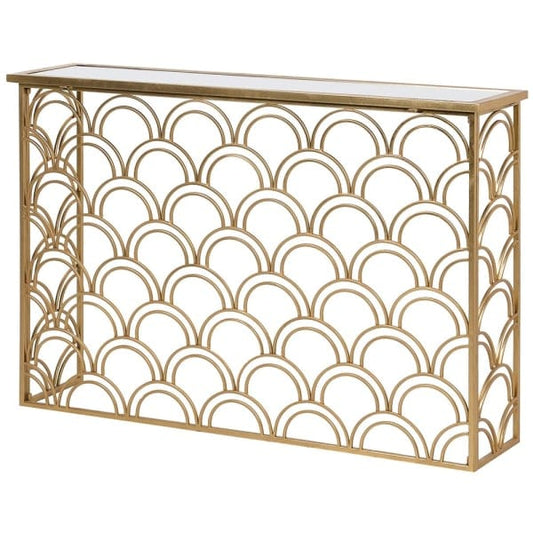A gold-colored metal console table with an arched base design and a mirrored top.
