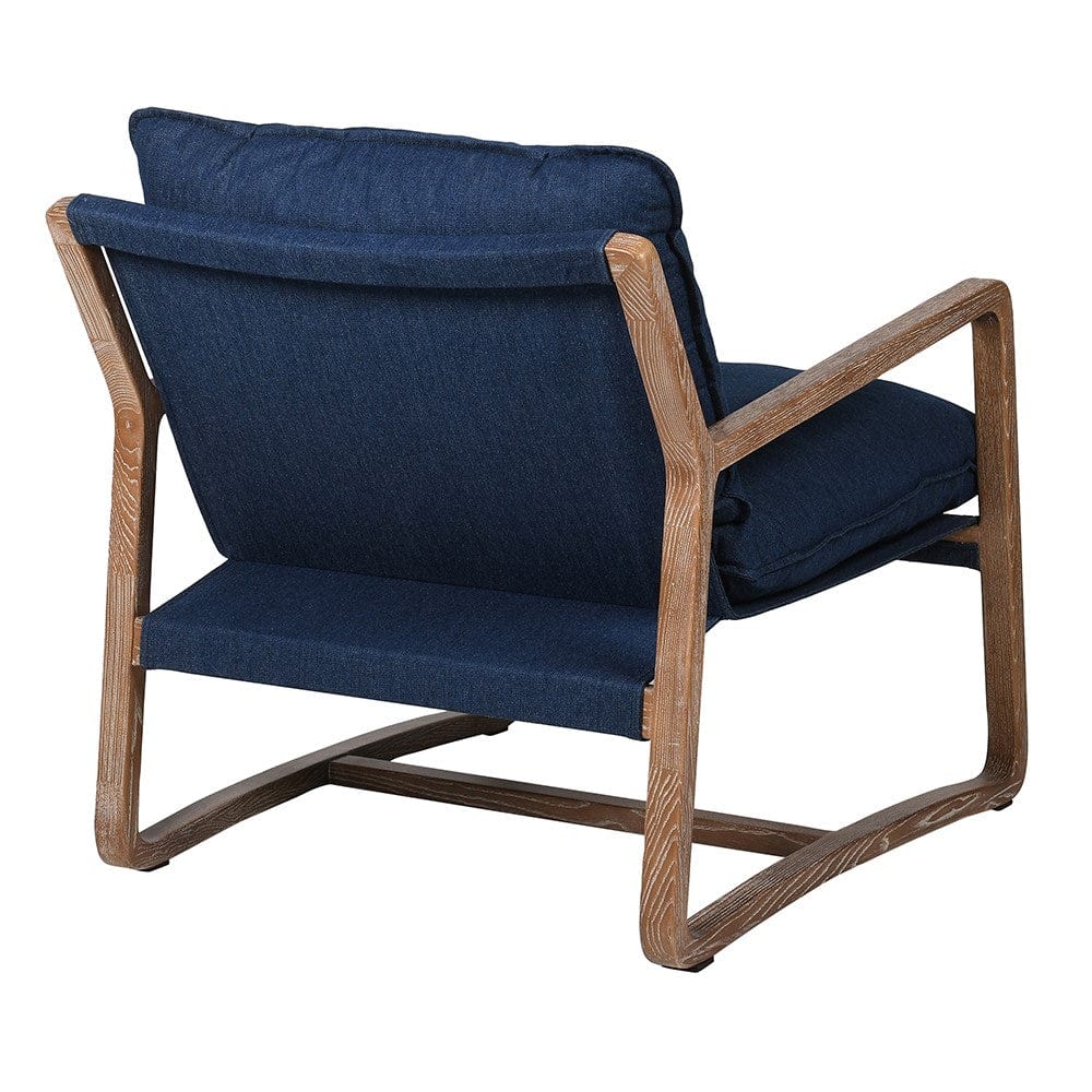 The rear of a dark blue denim armchair in a wooden frame