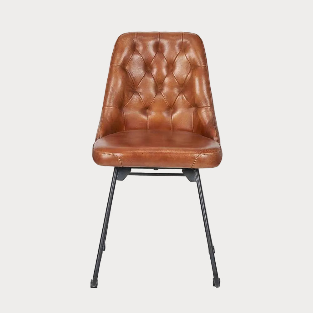 A vintage brown leather dining chair with black metal legs, featuring a diamond back design.