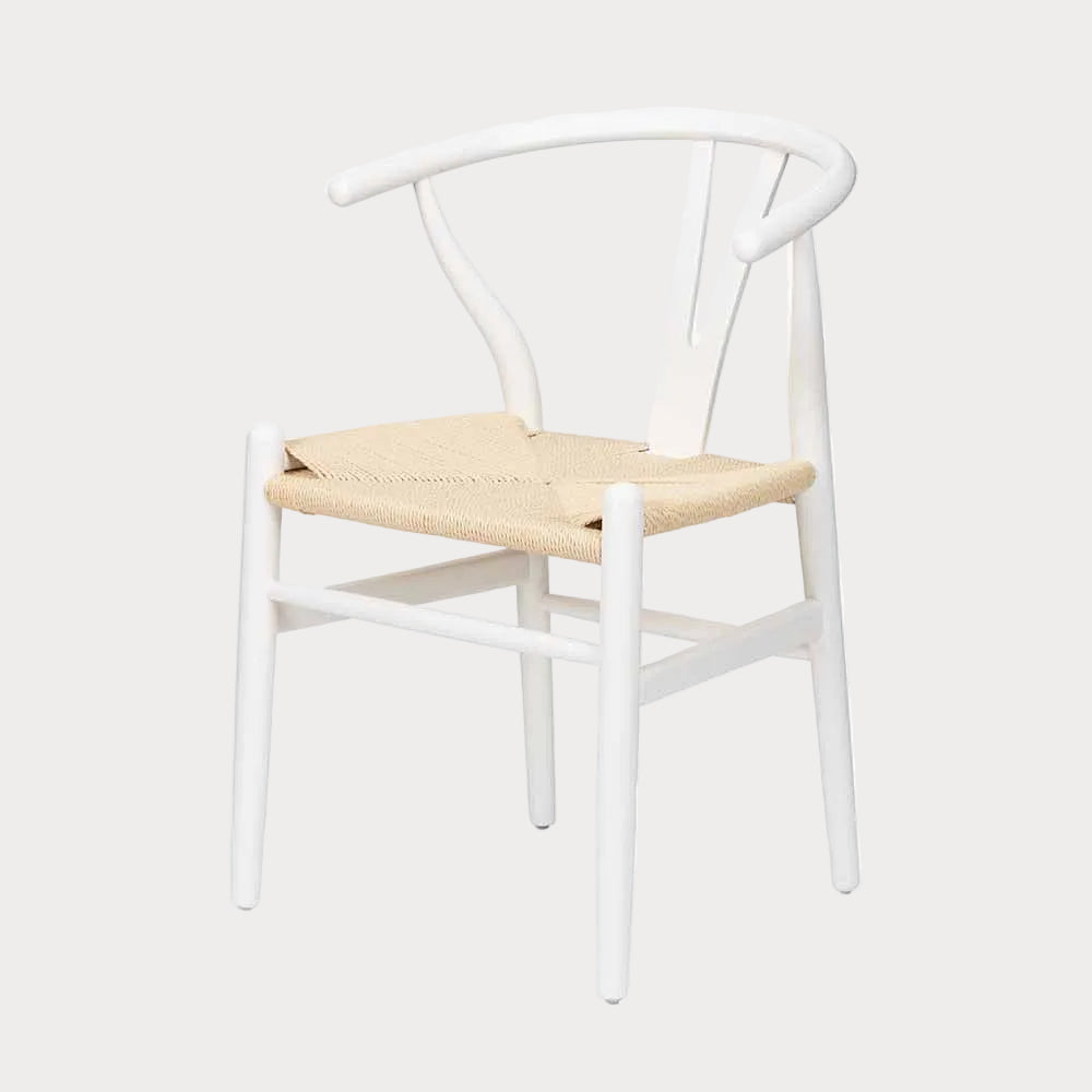 A white beech wood dining chair with a natural paper rope seat, featuring a Scandi-inspired design.