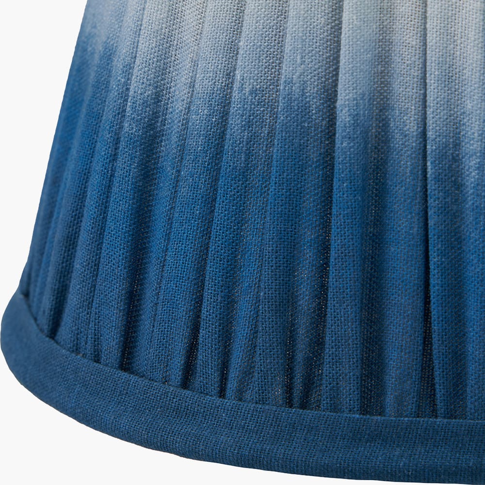 Close-up of a blue pleated fabric lampshade