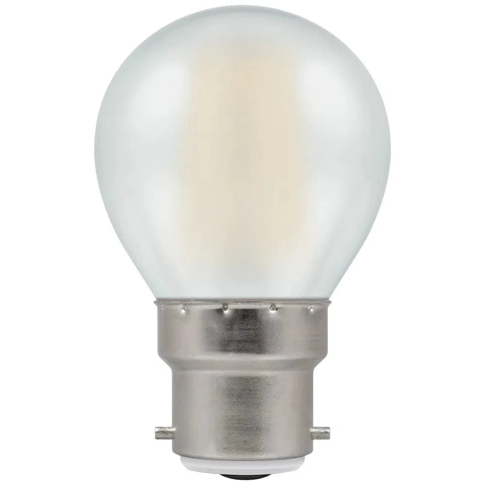 Clear light bulb with metal base on a white background