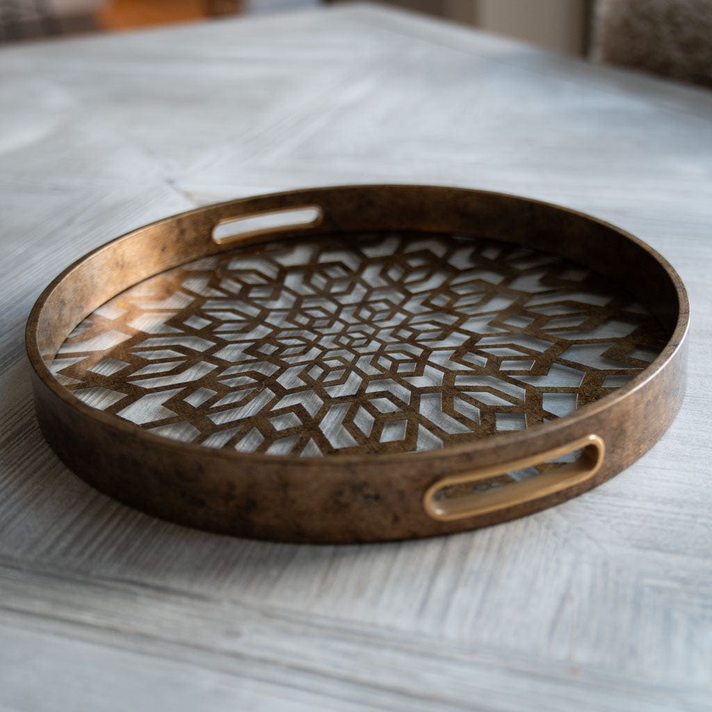 Bronze decorative tray on a marble surface