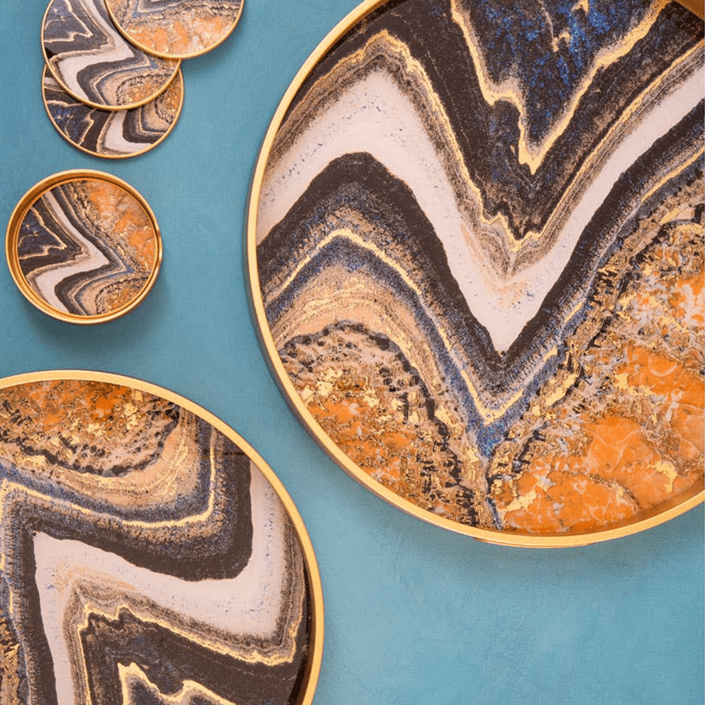 Decorative plates with marbled patterns on a blue background