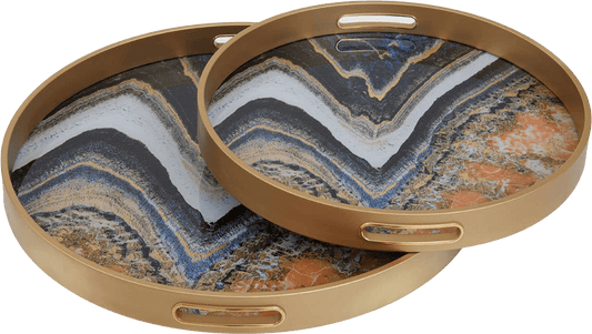 Two round marble-patterned trays with gold rims on a white background