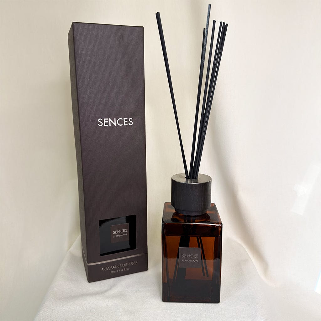 Sences fragrance diffuser with black reeds and packaging on a white background