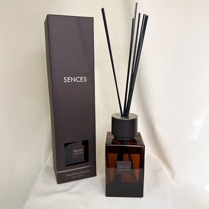 Sences fragrance diffuser with black reeds and packaging on a white background