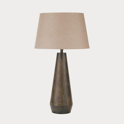 Table lamp with a brown textured base and beige lampshade on a white background