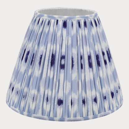 A blue and white ikat patterned cotton tapered drum shade for lamp post.