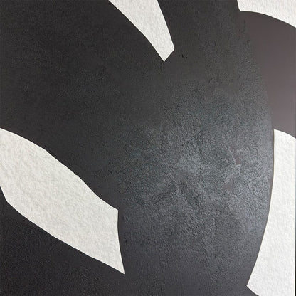 Close-up of a textured black surface with white geometric shapes