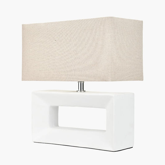 Table lamp with a beige lampshade on a white background