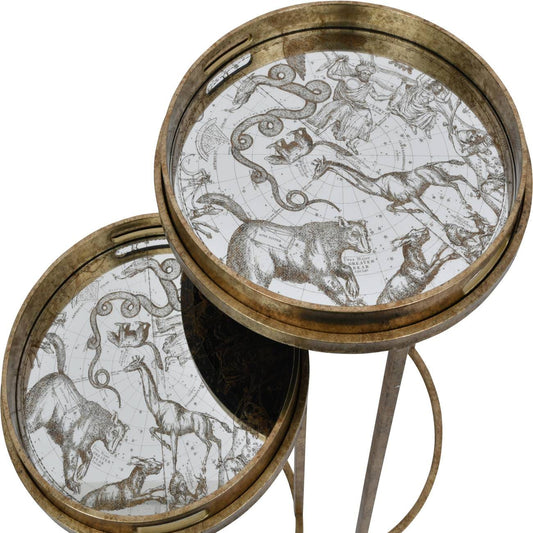 Two round side tray tables with gold trim and astrological constellation illustrations.