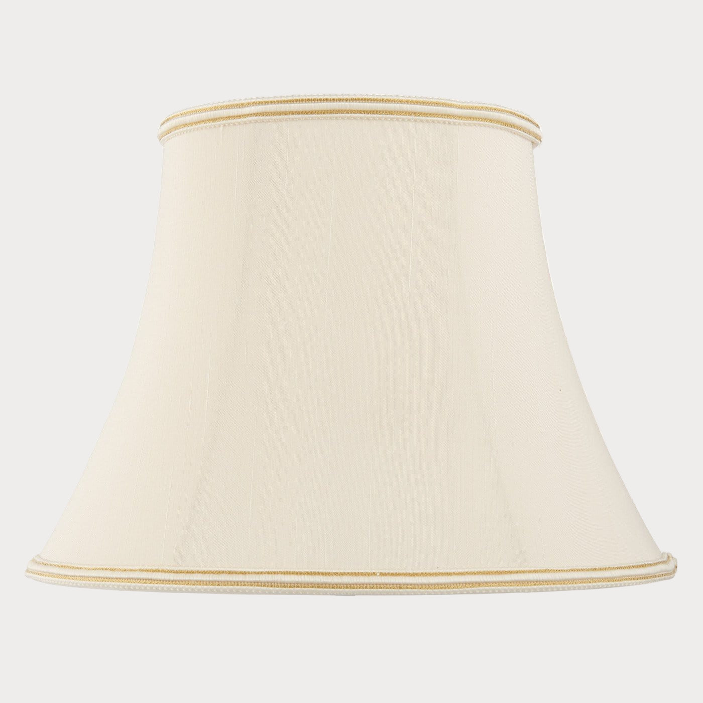 A cream-colored oval-shaped balloon-lined bowed shade with a subtle woven trim along the top and bottom edges.