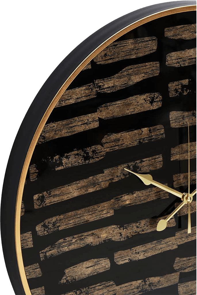 Wall clock with black and gold design on a white background