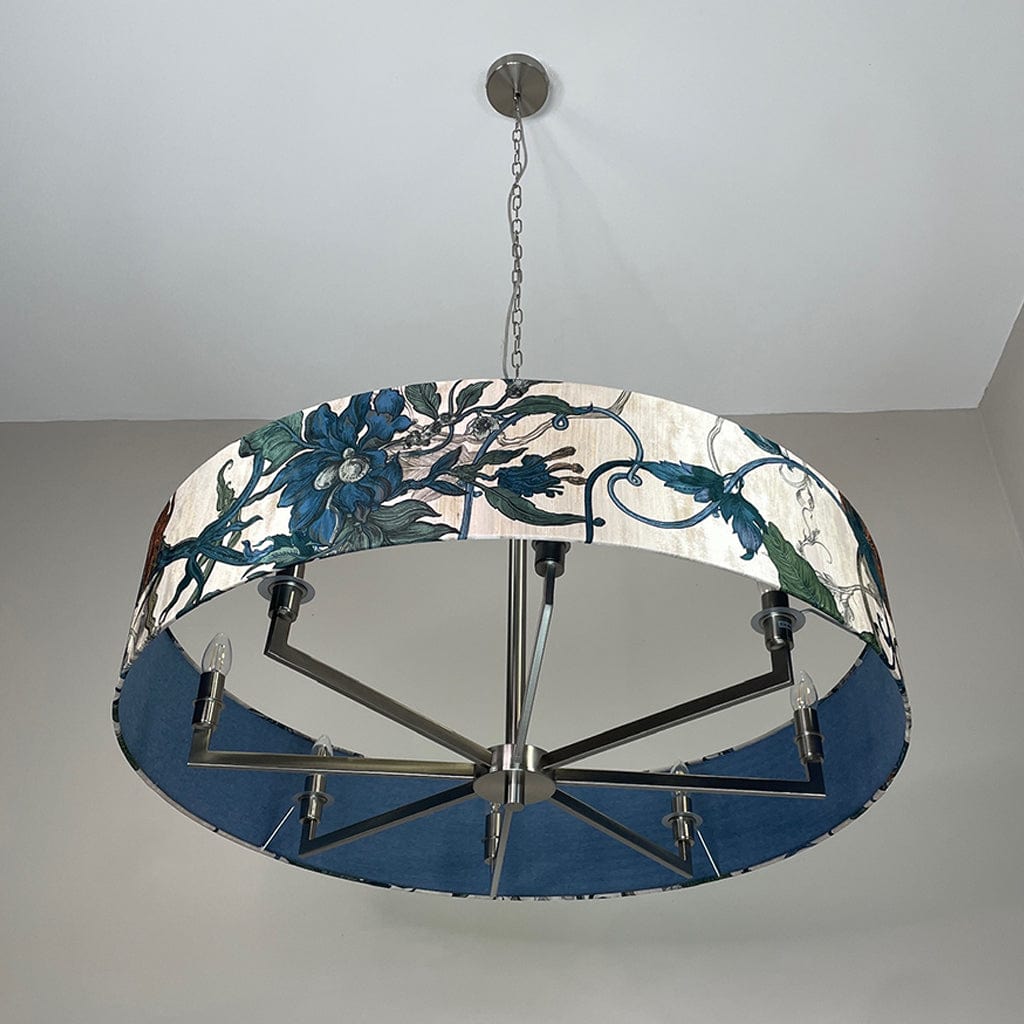 Decorative chandelier with floral design on a plain background