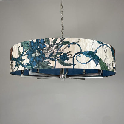 Decorative ceiling light fixture with floral design on a gray background