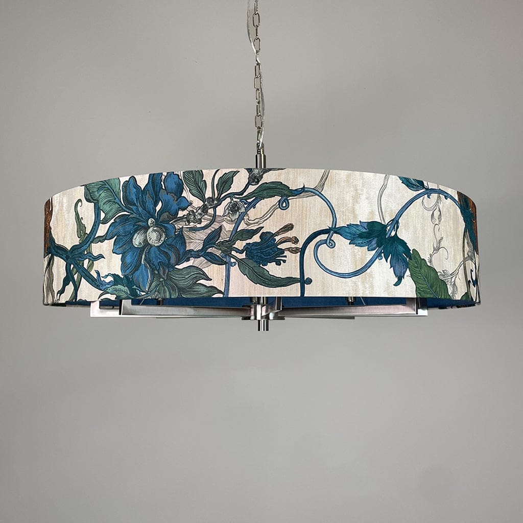 Decorative pendant light with floral design on a gray background