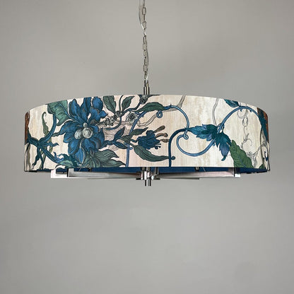 Decorative pendant light with floral design on a gray background