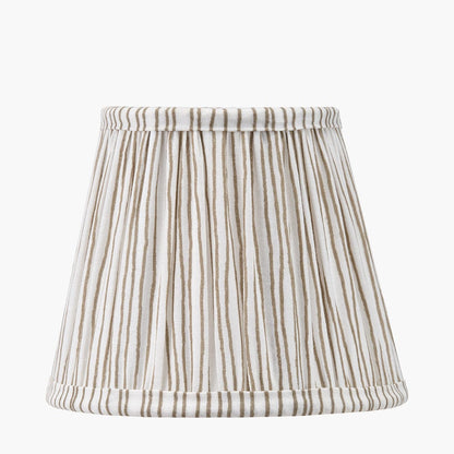 Striped lampshade with brown and white pattern on a white background