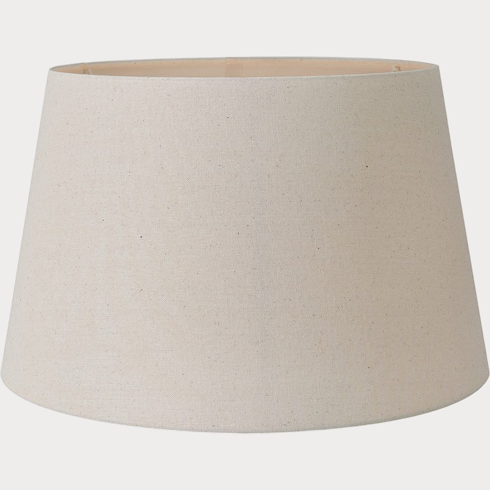 A beige, tapered cylinder lampshade made of cotton, designed for table or floor lamp use.