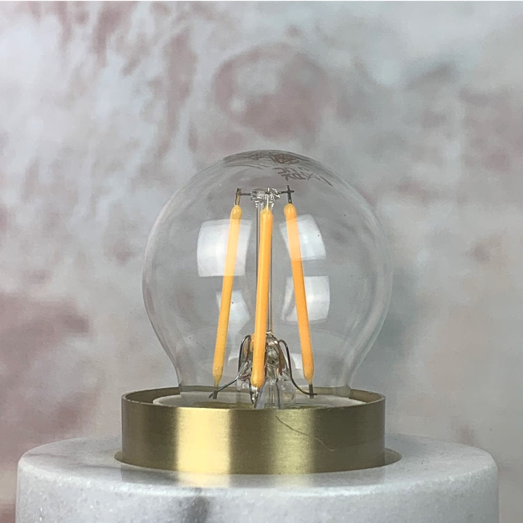 A clear E27 6.5W non-dimmable LED golfball-shaped light bulb with a silver E27 base.