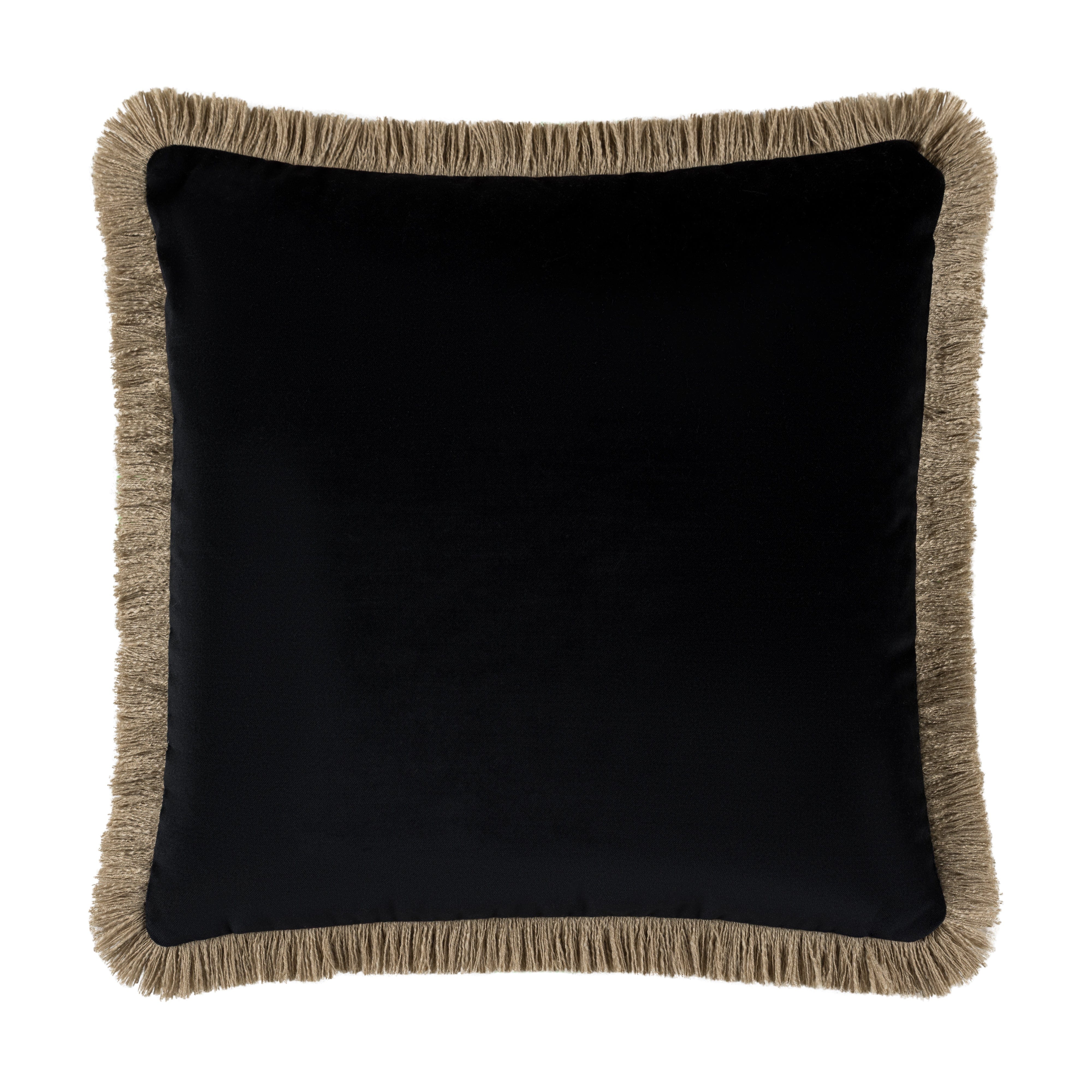 Black pillow with beige fringes on a white background