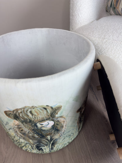 White linen storage stool, open, beside a white boucle sofa