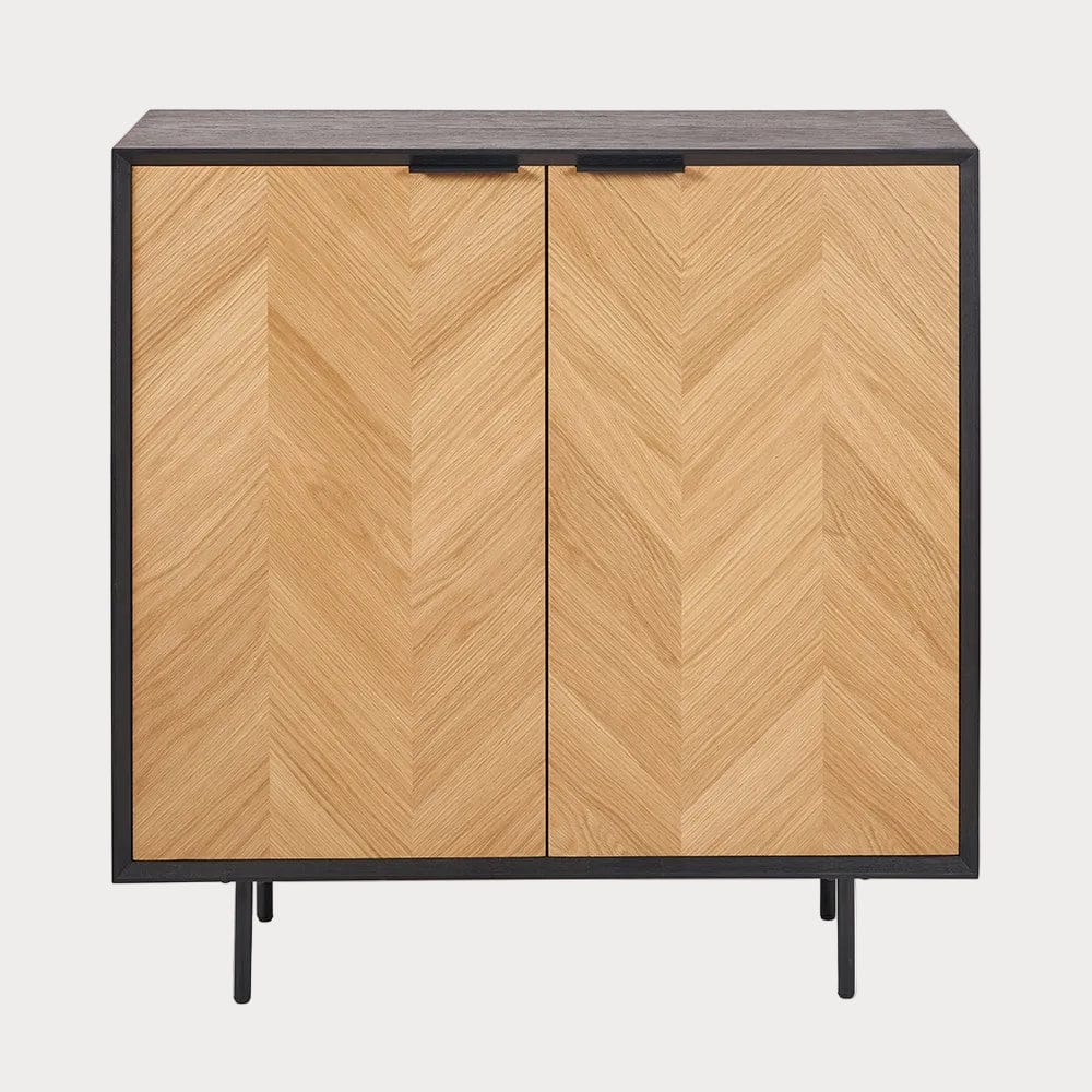 Wooden cabinet with chevron pattern on doors and black frame and legs on a white background
