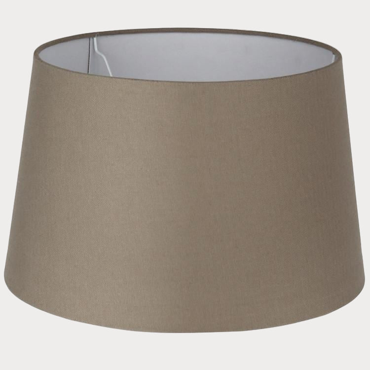 A taupe-colored, cotton handloom tapered cylinder lamp shade.
