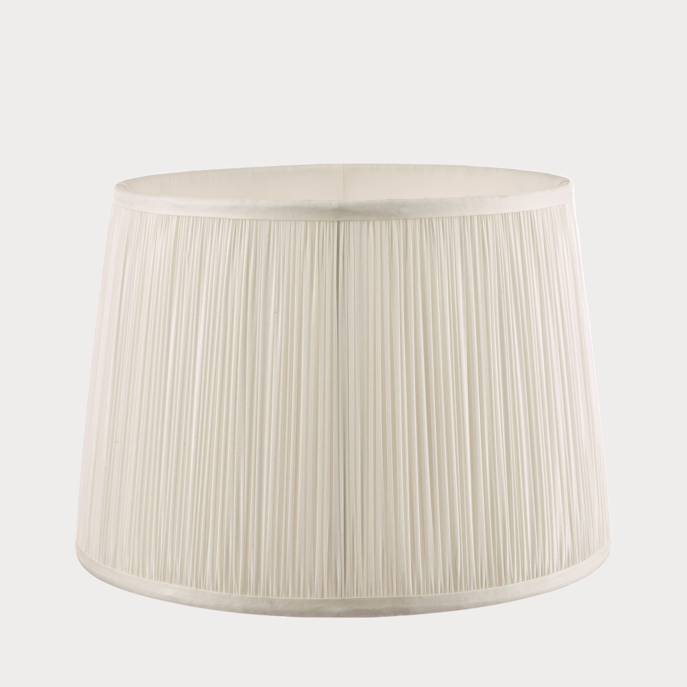 White pleated lampshade on a white background