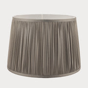 Gray pleated lampshade on a white background