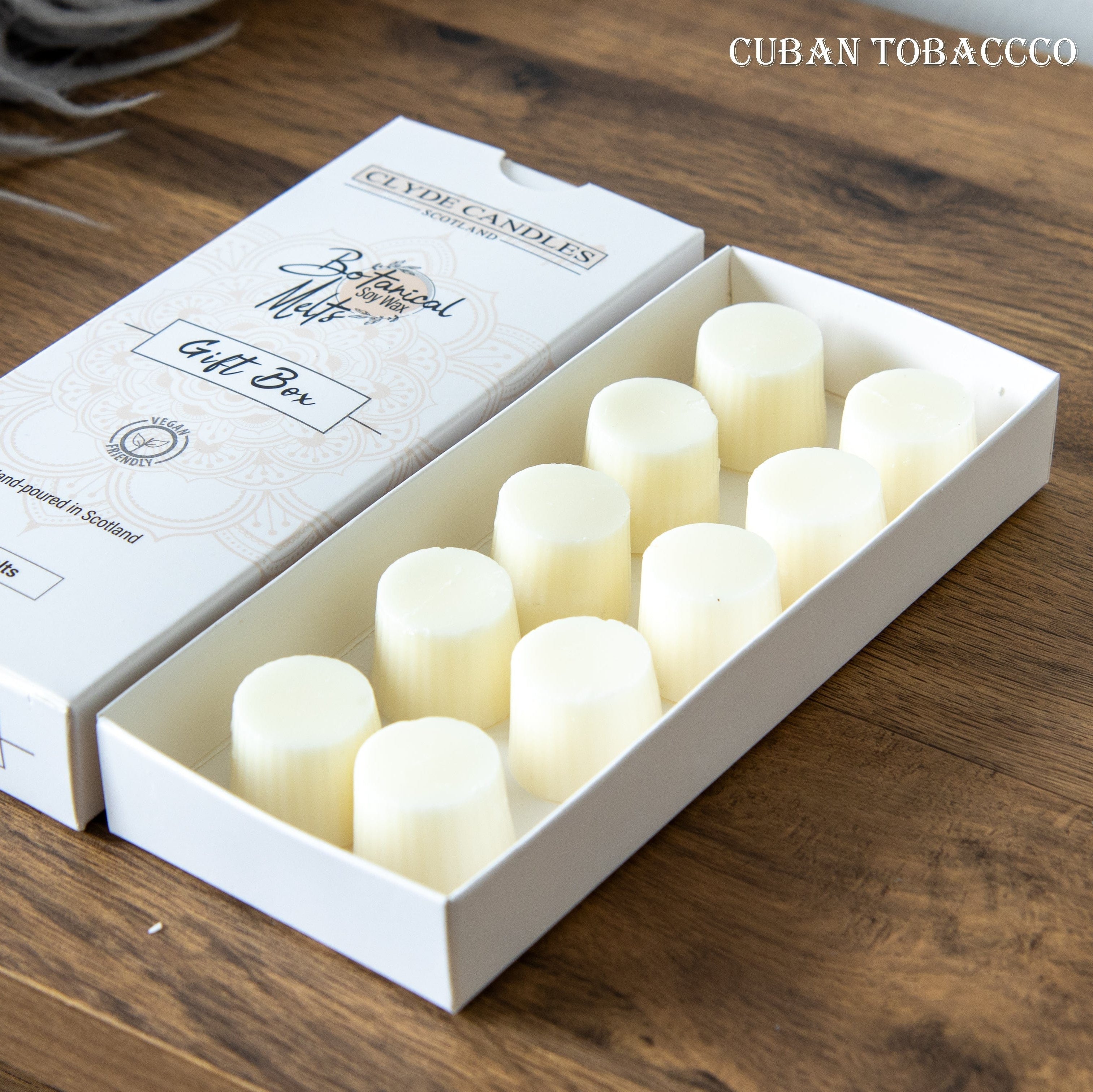 Box of LED candles labeled 'Cuban Tobacco' on a wooden surface