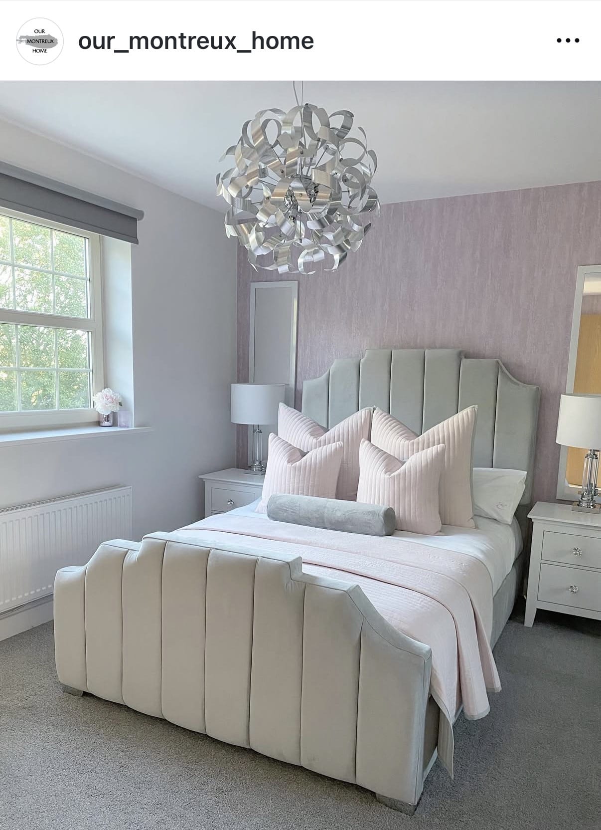 Neatly made bed with decorative pillows in a bedroom setting.