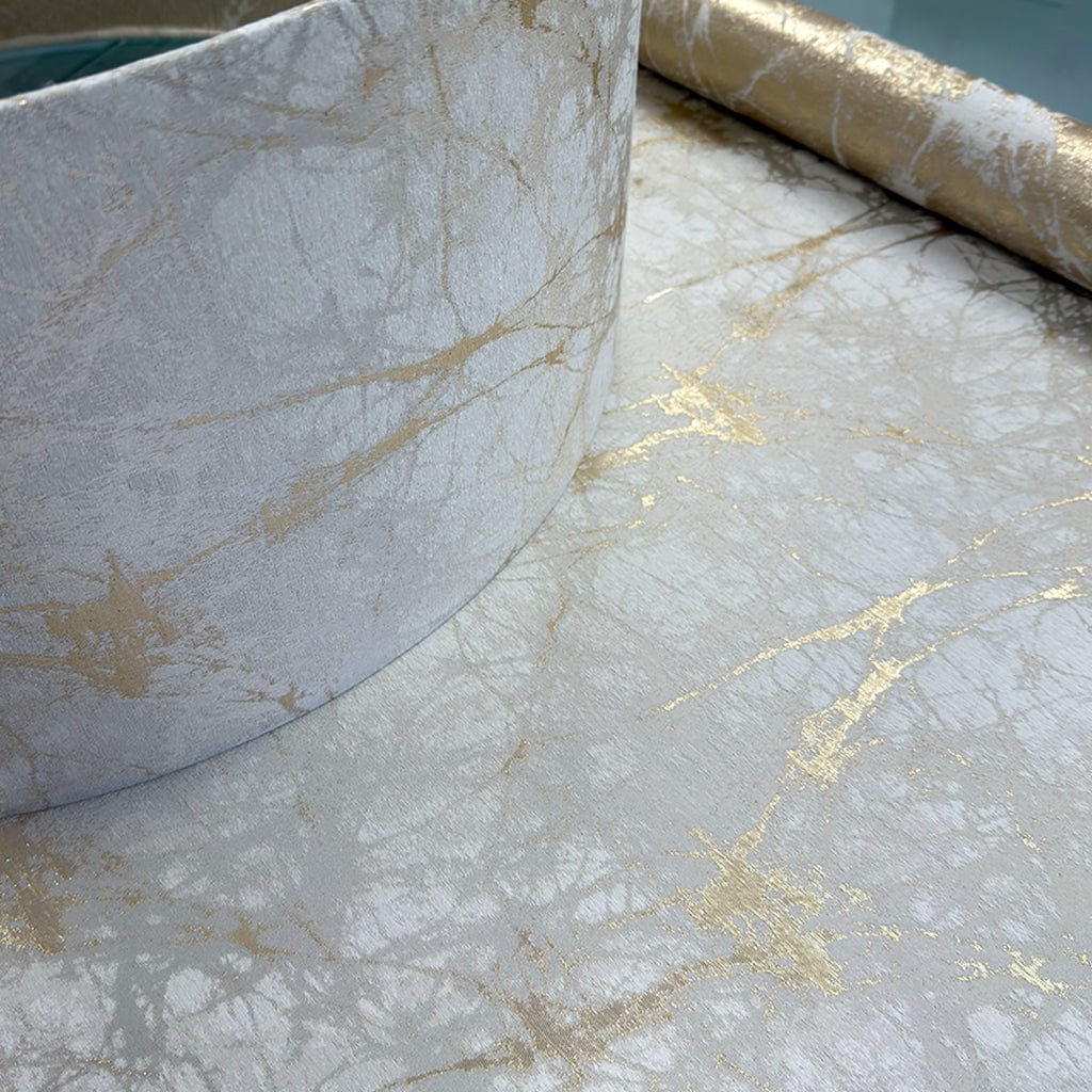 Marble-patterned paper with gold accents on a surface