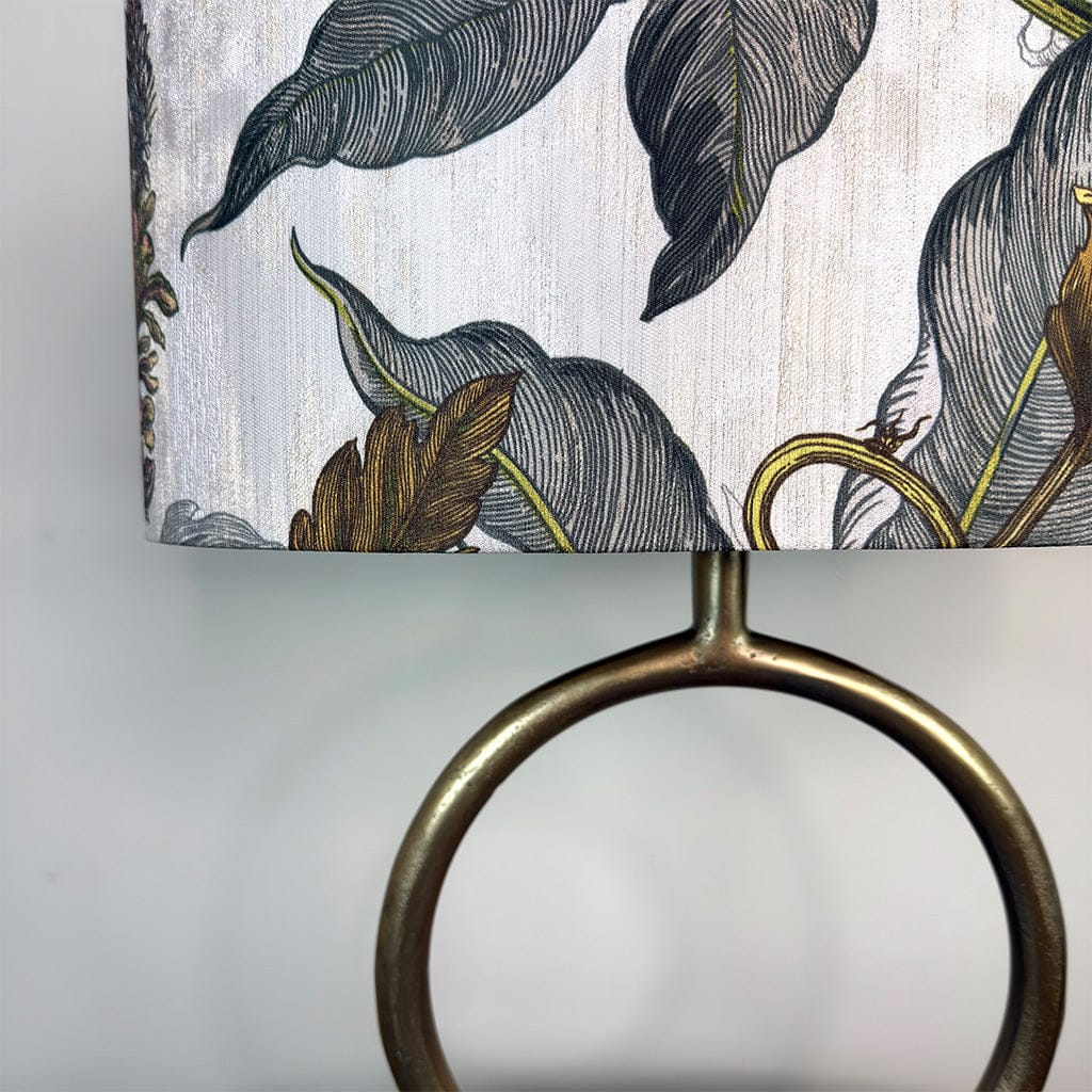 Decorative ring with leaf-patterned fabric background