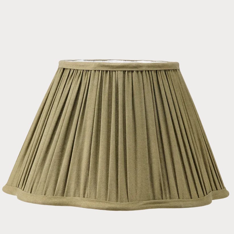 Green pleated lampshade on a white background