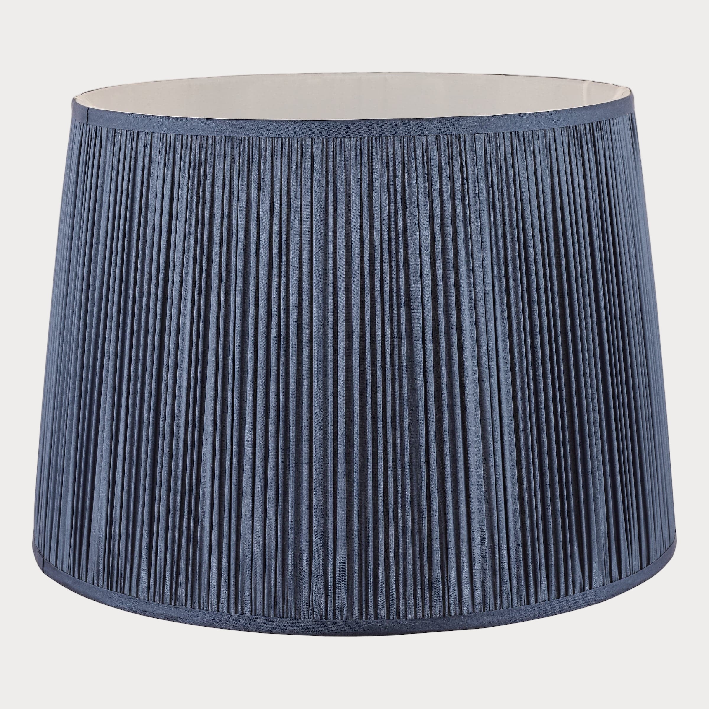 Blue pleated lampshade on a white background