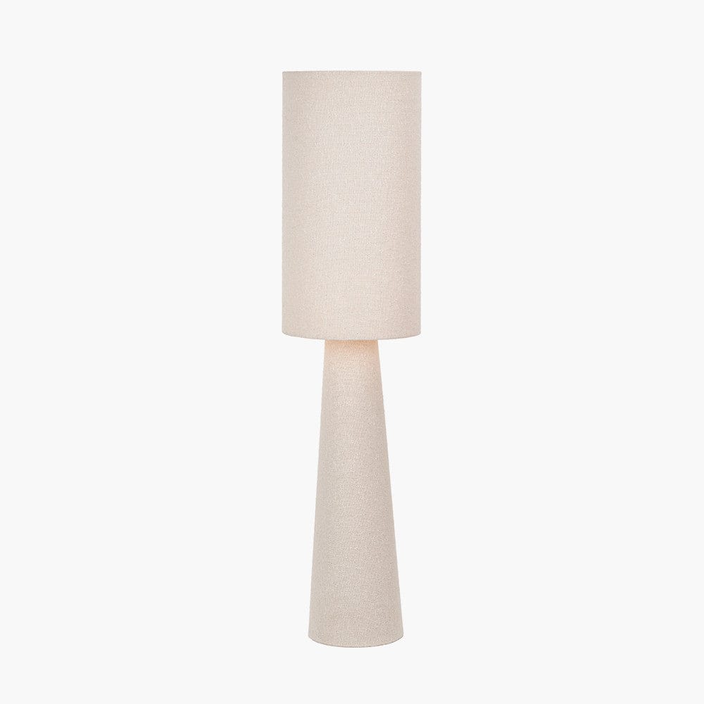 Beige floor lamp with a cylindrical base and round shade on a white background