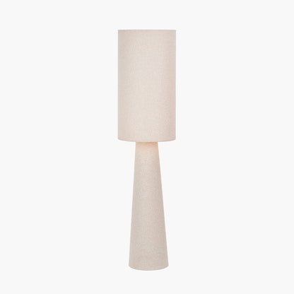 Beige floor lamp with a cylindrical base and round shade on a white background
