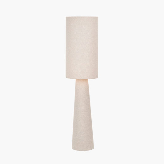 Beige floor lamp with a cylindrical base and round shade on a white background